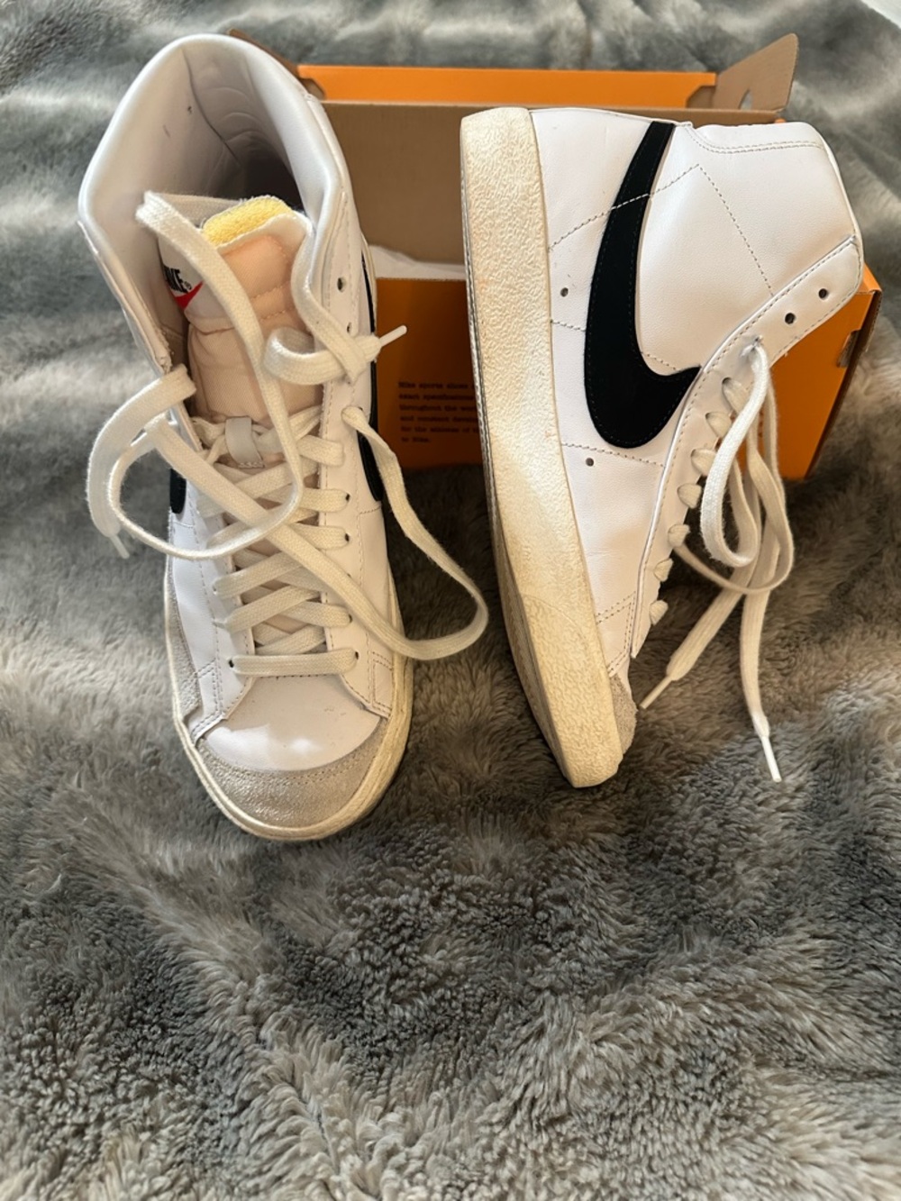 Nike White High-Top Sneakers with Black Swoosh